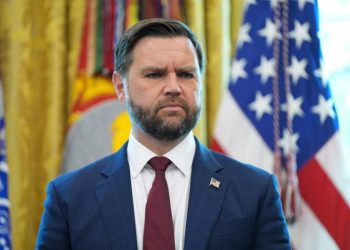 Vice President JD Vance listens as President Donald Trump holds an executive order signing ceremony in the Oval Office of the White House, Monday, Aug. 25, 2025, in Washington. (AP Photo/Evan Vucci)