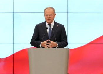 Poland's Prime Minister Donald Tusk , center, speaks during a press conference announcing changes in his government in Warsaw, Poland, Wednesday, July 23, 2025. (AP Photo/Czarek Sokolowski)